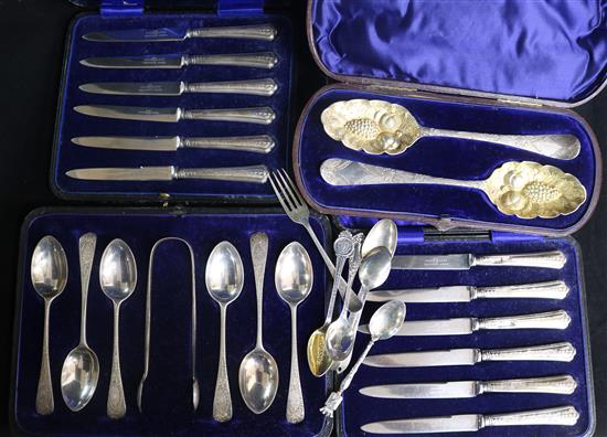 A cased matched pair of Georgian silver berry spoons, a set of teaspoons, two cased sets of cake knives and other silver spoons